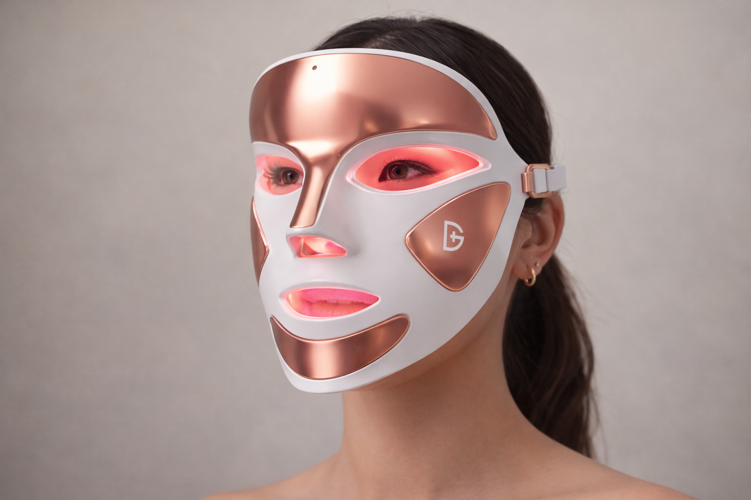 Woman wearing the Dr. Dennis Gross DRx SpectraLite FaceWare Pro LED face mask with red light therapy